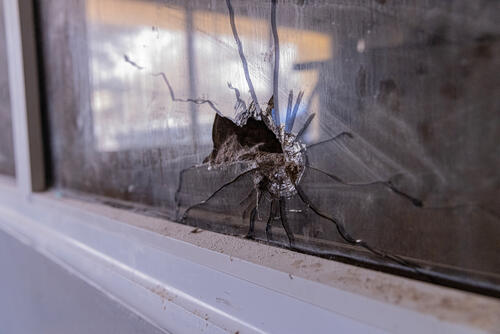 Bullet hole caused by shooting in the operating room of the Zalingei teaching hospital, Central Darfur state, Sudan. Bullet hole caused by shooting in the operating room of the Zalingei teaching hospital, Central Darfur state, Sudan.