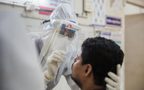 Dr sharanya in the fever clinic taking a sample 2.jpg Dr sharanya in the fever clinic taking a sample 2.jpg