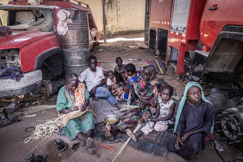 Aissa, 50, with her family sheltering in an abandoned and looted fire station, Zalingei, Sudan. Aissa, 50, with her family sheltering in an abandoned and looted fire station, Zalingei, Sudan.