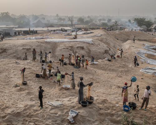 People work in a rice mill located at the entrance to Makurdi town People work in a rice mill located at the entrance to Makurdi town